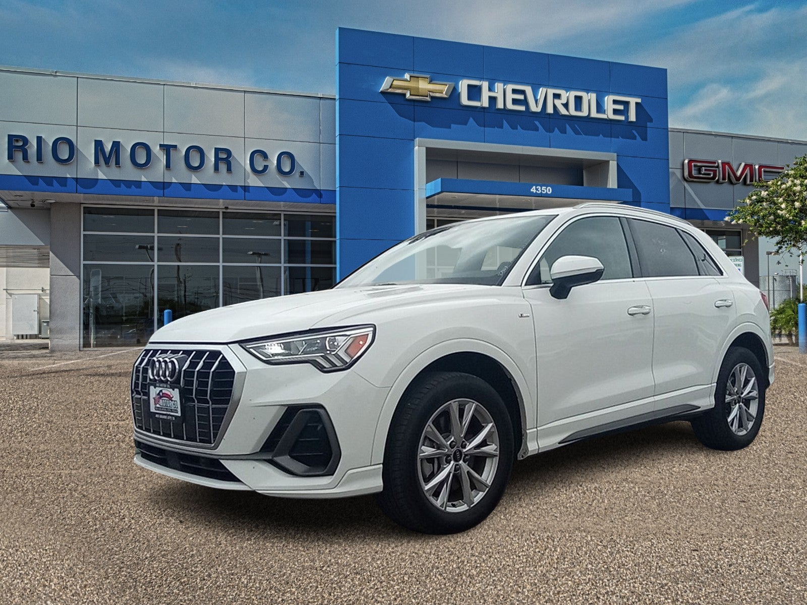 2025 Audi Q3 S line Premium in Progressive Red Me — front three-quarter view